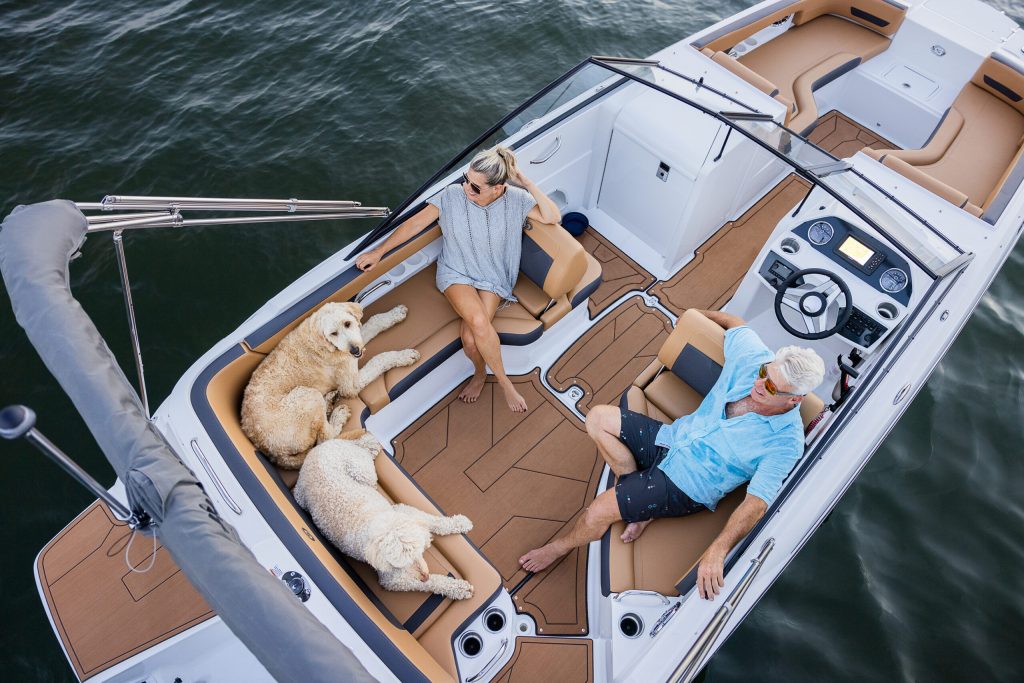 A couple and their dogs enjoying their new boat